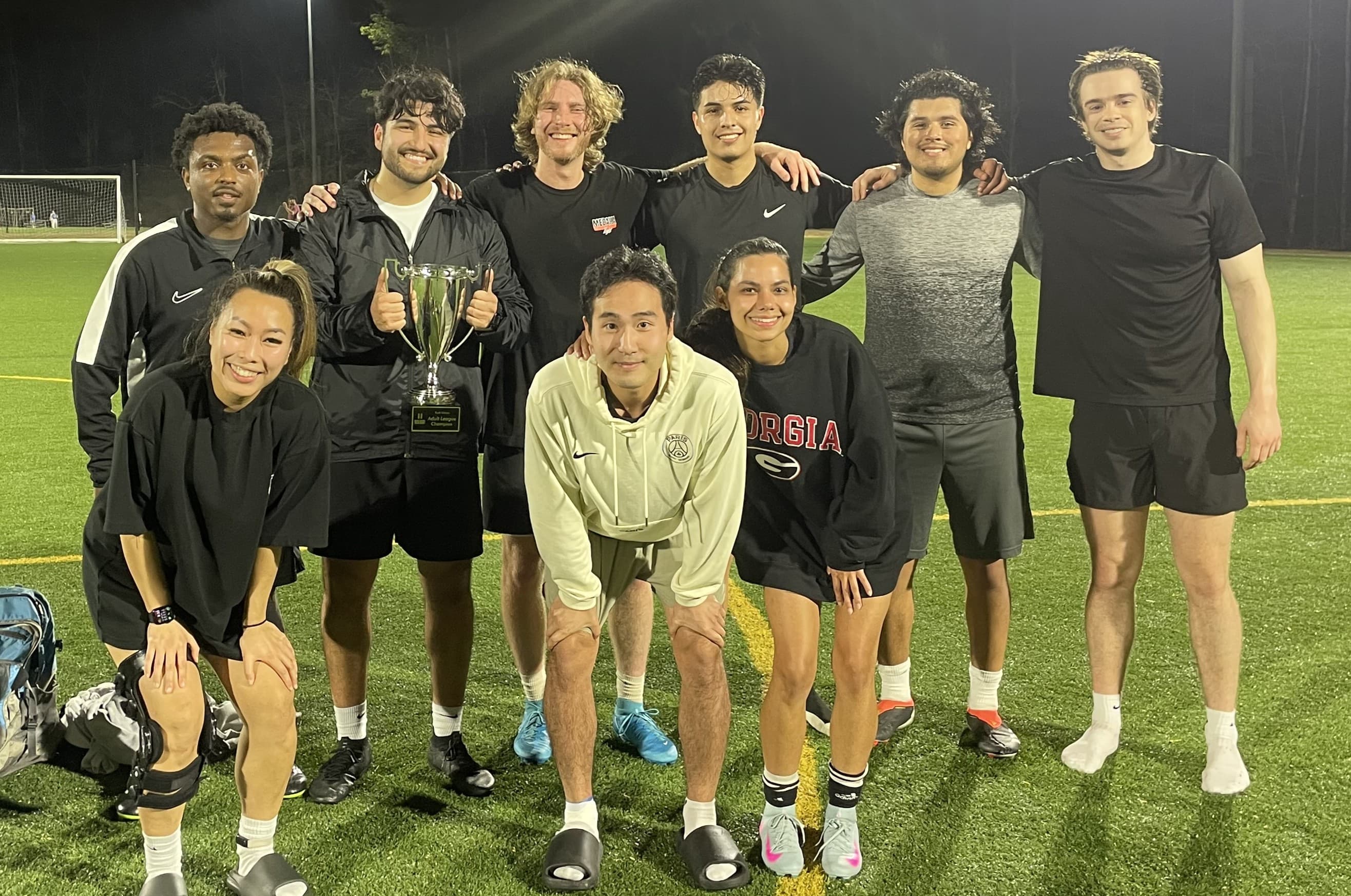 Savannah Vo with Adult Coed Winter 2026 soccer league winner trophy