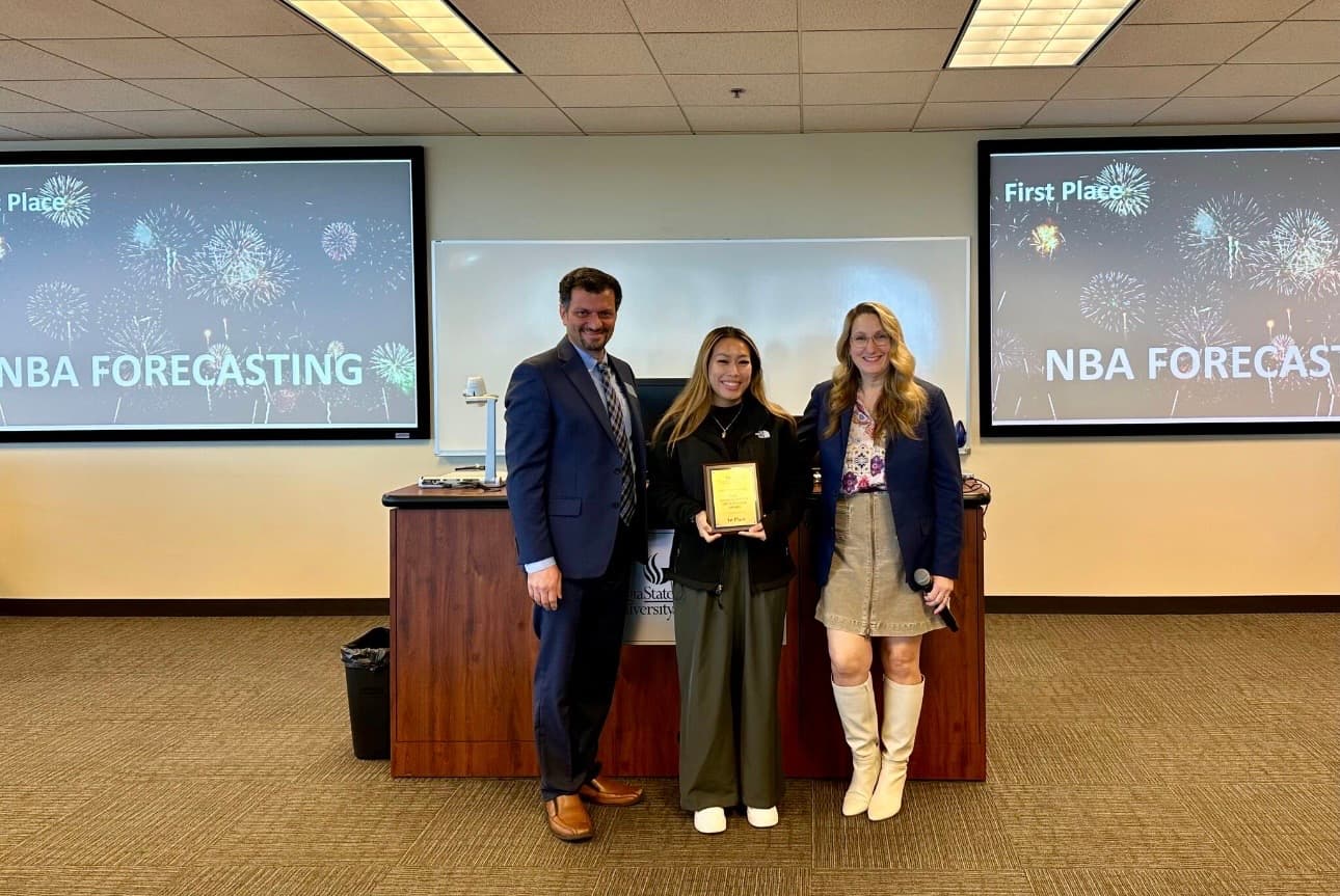 Savannah Vo receiving first place at the Institute for Insight AI and Analytics Conference for NBA Forecasting